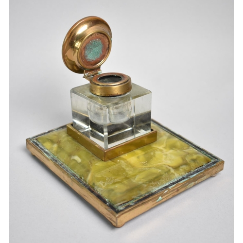 7 - An Edwardian Brass and Lucite Desktop Inkwell with Pen Rest, 10cms Wide