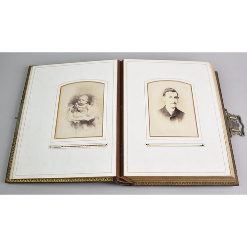 77 - A Late Victorian Photograph Album Containing Monochrome Family Portrait Photographs, Sprung Metal Cl... 