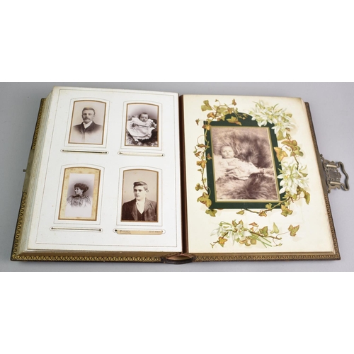 77 - A Late Victorian Photograph Album Containing Monochrome Family Portrait Photographs, Sprung Metal Cl... 