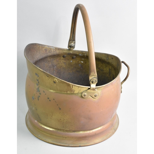 91 - A Mid 20th Century Brass Helmet Shaped Coal Scuttle