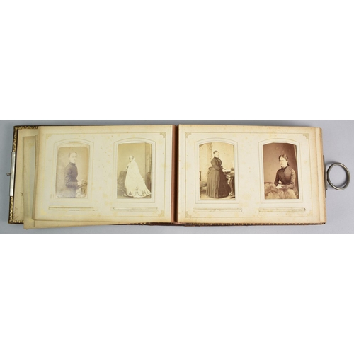 92 - A Late Victorian Photograph Album with Metal Clasp Containing Monochrome Family Portrait Photographs