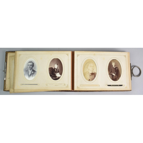 92 - A Late Victorian Photograph Album with Metal Clasp Containing Monochrome Family Portrait Photographs