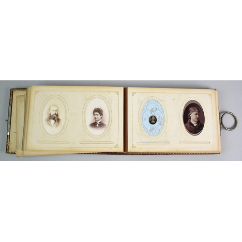 92 - A Late Victorian Photograph Album with Metal Clasp Containing Monochrome Family Portrait Photographs