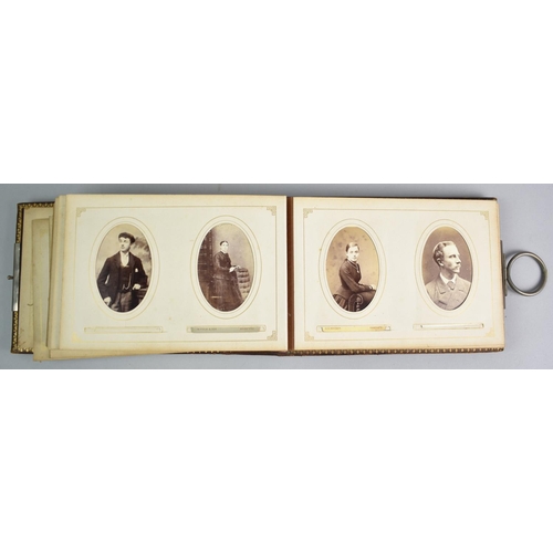 92 - A Late Victorian Photograph Album with Metal Clasp Containing Monochrome Family Portrait Photographs