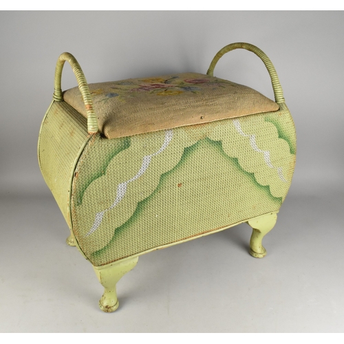 534 - A Mid Century Green Painted Wicker Storage Stool with Tapestry Seat and Loop Handles, 57x34x58cm hig... 