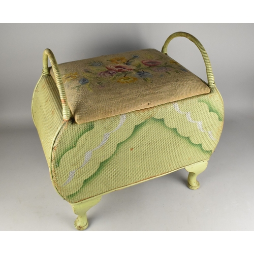 534 - A Mid Century Green Painted Wicker Storage Stool with Tapestry Seat and Loop Handles, 57x34x58cm hig... 