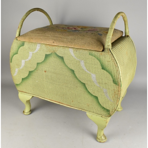 534 - A Mid Century Green Painted Wicker Storage Stool with Tapestry Seat and Loop Handles, 57x34x58cm hig... 