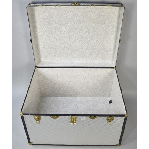 544 - A Large Banded Aluminium Travelling Trunk, 99x76.5x63.5cm