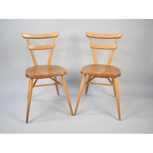 555 - A Pair of Mid Century Ercol Green Dot Chairs