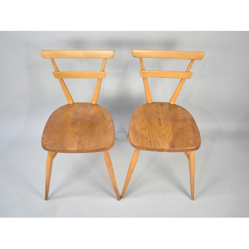 555 - A Pair of Mid Century Ercol Green Dot Chairs