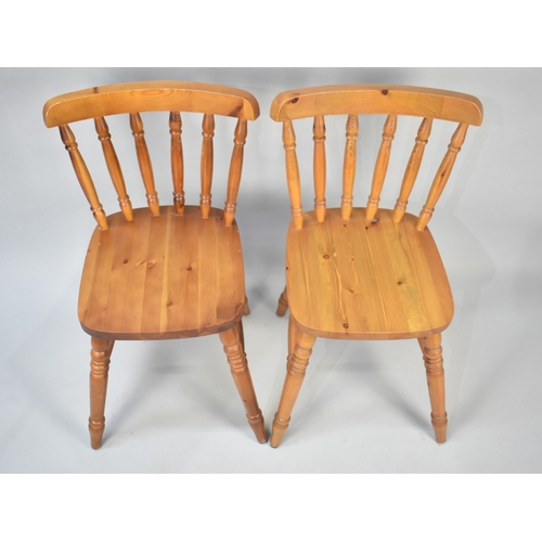 556 - Four Modern Pine Spindle Back Chairs