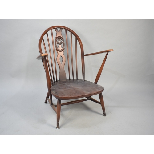 558 - An Ercol Fleur De Lys Armchair