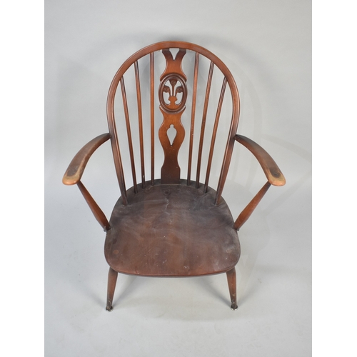 558 - An Ercol Fleur De Lys Armchair