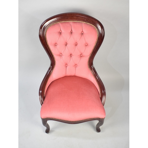 560 - A Reproduction Victorian Mahogany Framed Ladies Chair with Pink Upholstery and Button Back