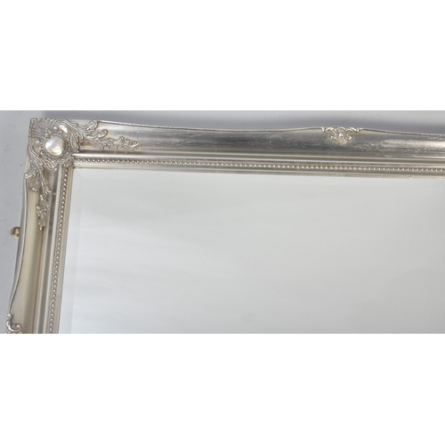 568 - A Modern Silvered Framed Rectangular Wall Mirror, 106cms by 76cms