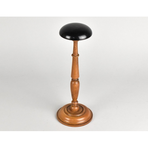 57 - A Late Victorian/Edwardian Turned Wooden Wig Stand with Ebonised Top, 25cms High