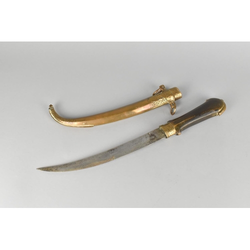 10 - A North African Wooden Handled Curved Blade Dagger with Brass Scabbard