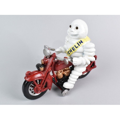 137 - A Reproduction Cold Painted Cast Iron Advertising Figure, Michelin Man on Motorcycle, 22cm Long