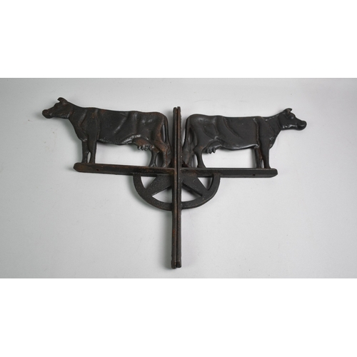 142 - A Pair of Cast Iron Wall Hanging Mounts or Brackets in the Form of Dairy Cows, 35cm High