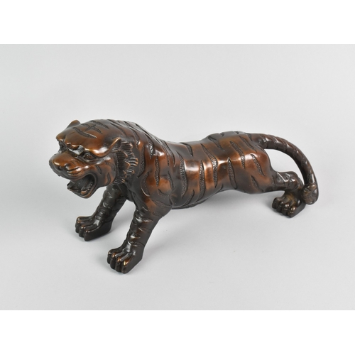 148 - A Large Bronze Study of an Oriental Tiger, 33cm Long