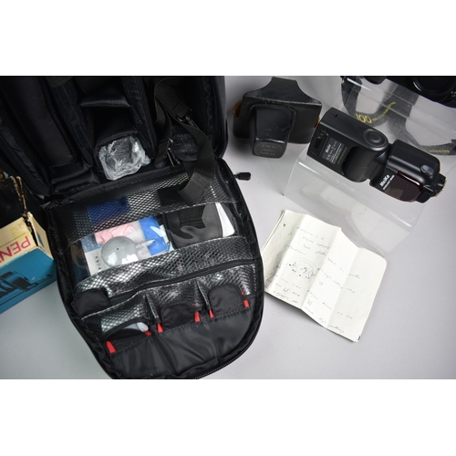 249 - A Camera Knapsack Containing a Nikon F100 Camera and Accessories to Include Flashgun also to Include... 