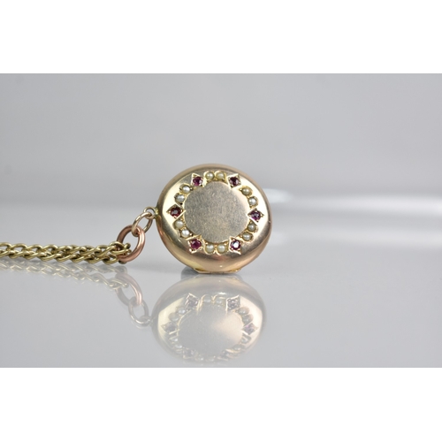 436 - A 9ct Gold Curb Link Chain with a Ruby and Seed Pearl Mounted Circular Yellow Metal Locket, Locket w... 