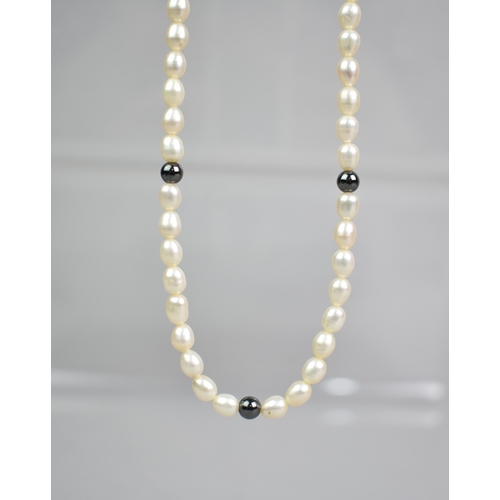 450 - A Pearl and Haematite Necklace, 45cms Long, with Silver Spring Barrel Clasp