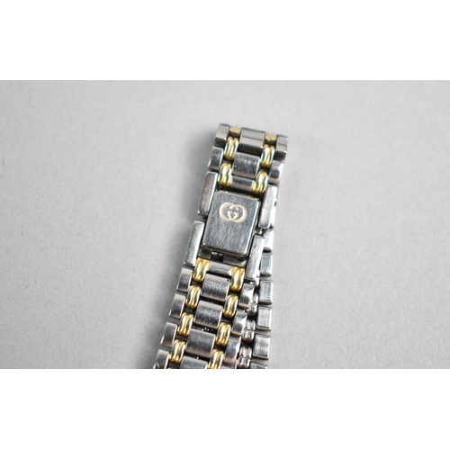 452 - A Ladies Gucci Wrist Watch, Stainless Steel, Black Face with White Stones Hour Indicators and Date A... 