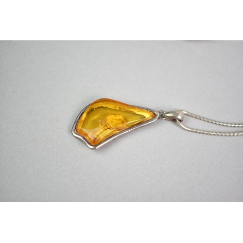 455 - A Vintage Hinged Silver Bangle together with a Silver and Amber Pendant on Chain, Pendant 40mm Long ... 