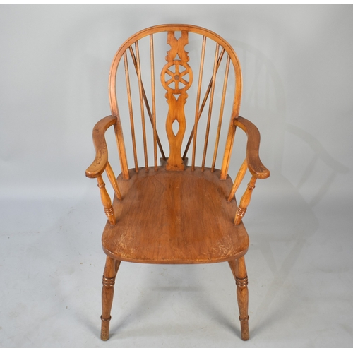 538 - A Mid Century Wheel Back Armchair