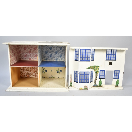 557 - A Vintage Dolls House with Painted Metal Sliding Front