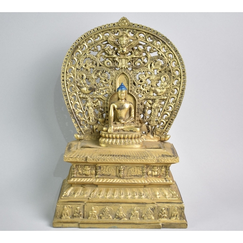 188 - A Tibetan Gilt Bronze Kneeling Buddha on Throne, 28cms High