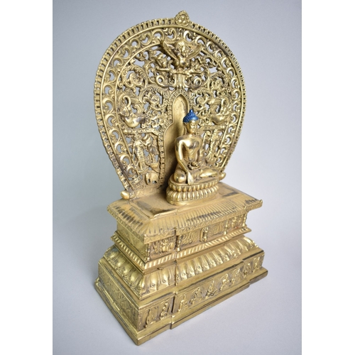 188 - A Tibetan Gilt Bronze Kneeling Buddha on Throne, 28cms High