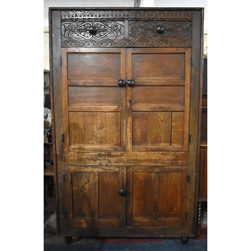 580 - An Edwardian Oak Linen Cupboard with Carved Top Panel and Two Pairs of Panelled Doors, 122cms Wide b... 