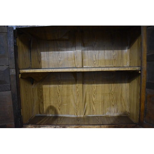 580 - An Edwardian Oak Linen Cupboard with Carved Top Panel and Two Pairs of Panelled Doors, 122cms Wide b... 