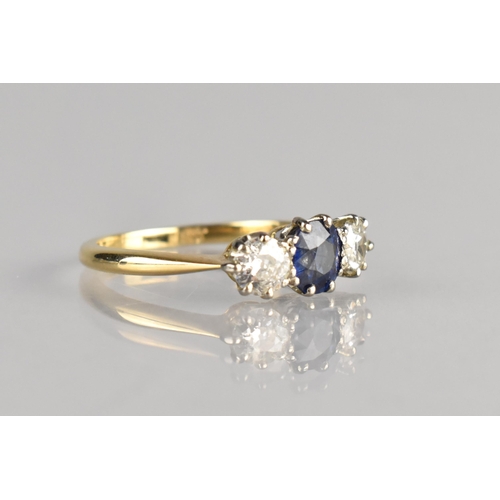 4 - A Sapphire and Diamond Trilogy Ring, Central Oval Cut Sapphire Measuring 5.6mm by 4.6mm Supported in... 