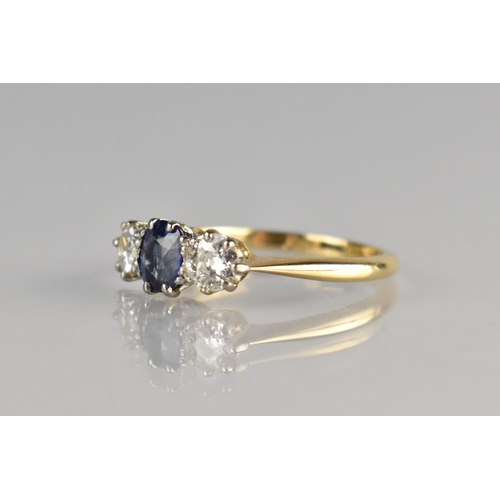 4 - A Sapphire and Diamond Trilogy Ring, Central Oval Cut Sapphire Measuring 5.6mm by 4.6mm Supported in... 