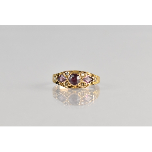 9 - A 19th Century Almandine Garnet and Seed Pearl Ring, Central Round Cut Stone Measuring 3.8mm Diamete... 