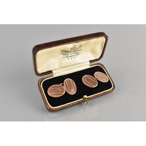 67 - A Pair of 9ct Rose Gold Cufflinks, Oval Faces with Linea Engine Turned Decoration, 7.8gms, Hallmark ... 