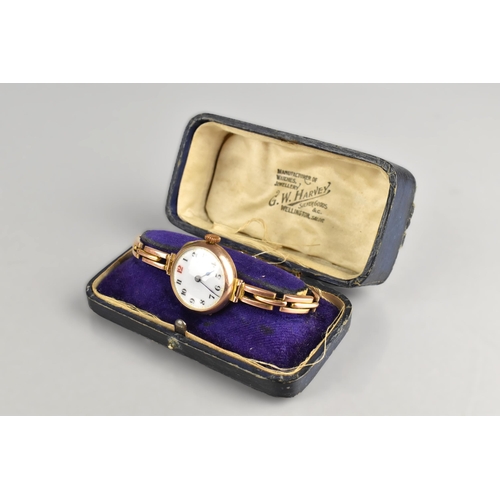 69 - An Early 20th Century 9ct Rose Gold Cased Wrist Watch, White Enamel Dial with Arabic Numerals in Bla... 