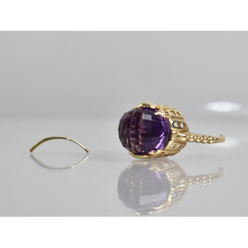 26 - A Modern Gold Metal and Amethyst 'Taj Mahal' Ring, Faceted Domed Amethyst Measuring 12.7mm Diameter ... 