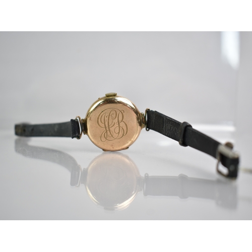 76 - An Early 20th Century Gold Cased 'Trench' Watch, White Enamel Face with Black Arabic Numerals having... 