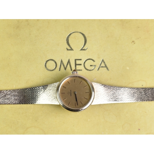 77 - A 1970s Boxed Ladies Omega Mechanical Wrist Watch, Round Gold Face with Stick Hands and Hour Indicat... 