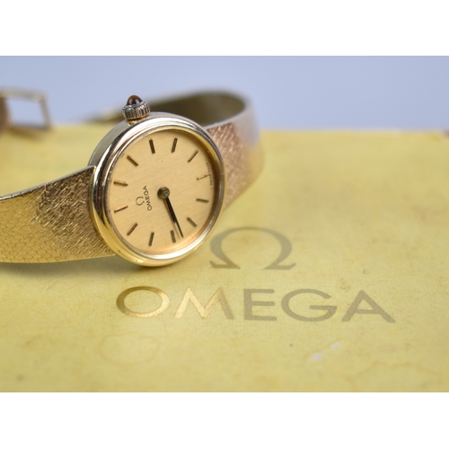 77 - A 1970s Boxed Ladies Omega Mechanical Wrist Watch, Round Gold Face with Stick Hands and Hour Indicat... 