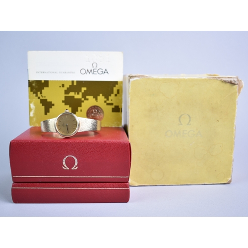 77 - A 1970s Boxed Ladies Omega Mechanical Wrist Watch, Round Gold Face with Stick Hands and Hour Indicat... 