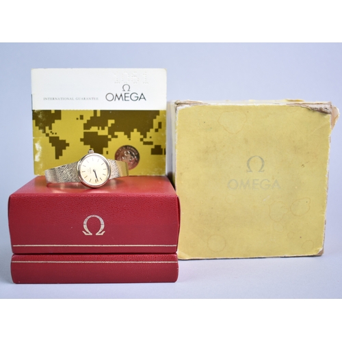 77 - A 1970s Boxed Ladies Omega Mechanical Wrist Watch, Round Gold Face with Stick Hands and Hour Indicat... 