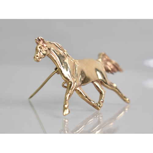 14 - A 9ct Gold Brooch, Horse Trotting, Sheffield 1998 with Makers Mark AA, 56mm Long, 12.9gms,