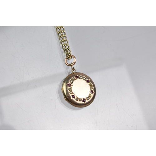 56 - A 9ct Gold Curb Link Chain with a Ruby and Seed Pearl Mounted Circular Yellow Metal Locket, Locket w... 