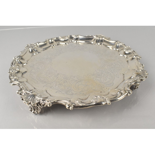 191 - A Victorian Silver Salver by Smith, Nicholson & Co., with Scrolled Shell Relief Trim and Raised on C... 