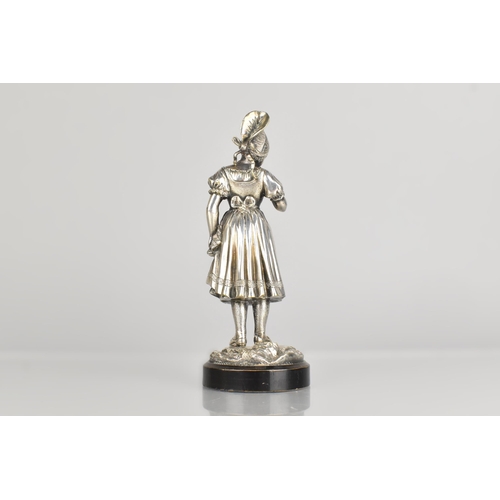 129 - An Early/Mid 20th Century Silver Plated Car Mascot/Figure of Bavarian Maiden in Traditional Dress on... 